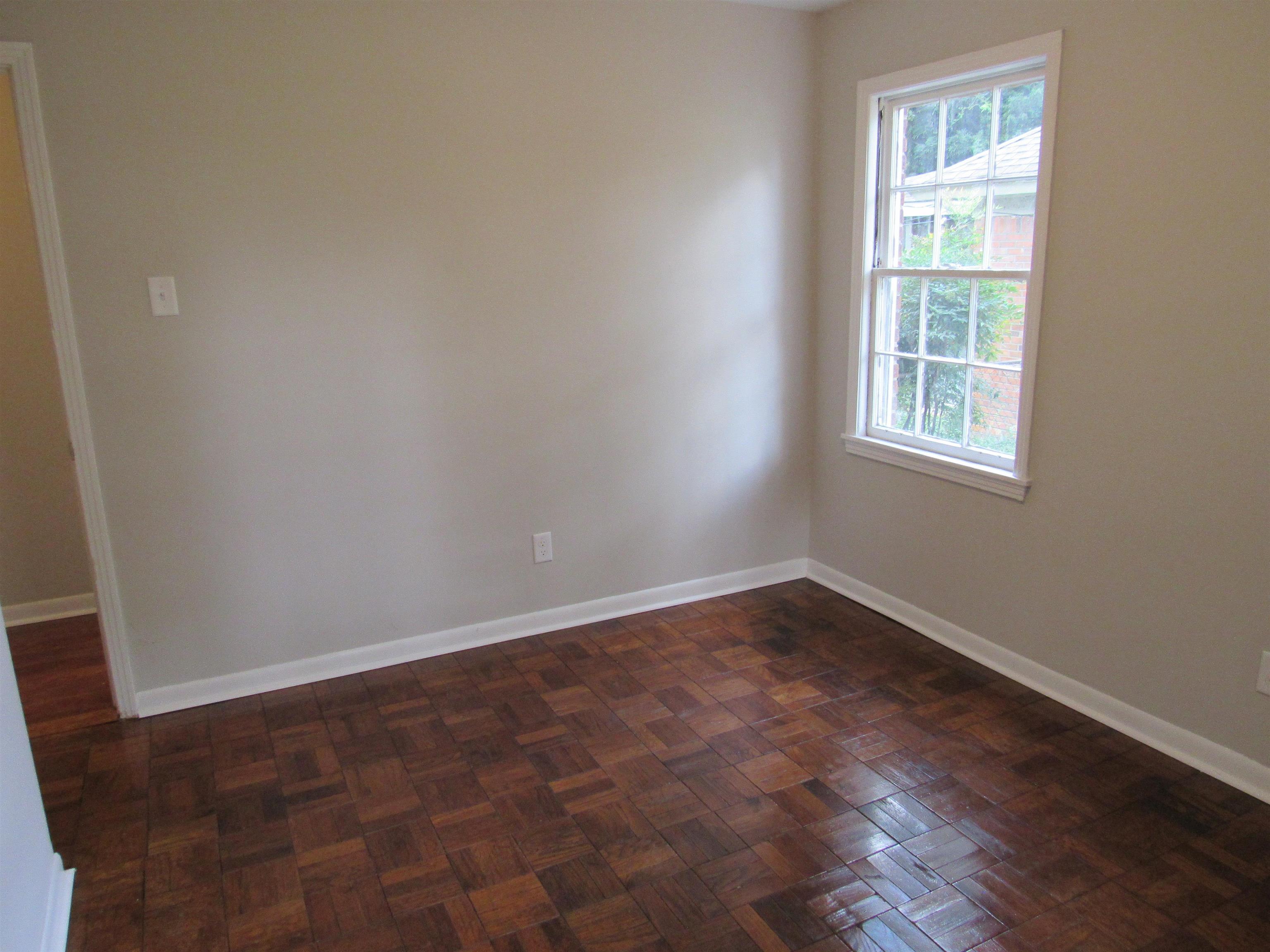 5055 Wingdale Road Memphis, TN 38117 - Photo 14 of 20 Empty room with parquet floors and baseboards