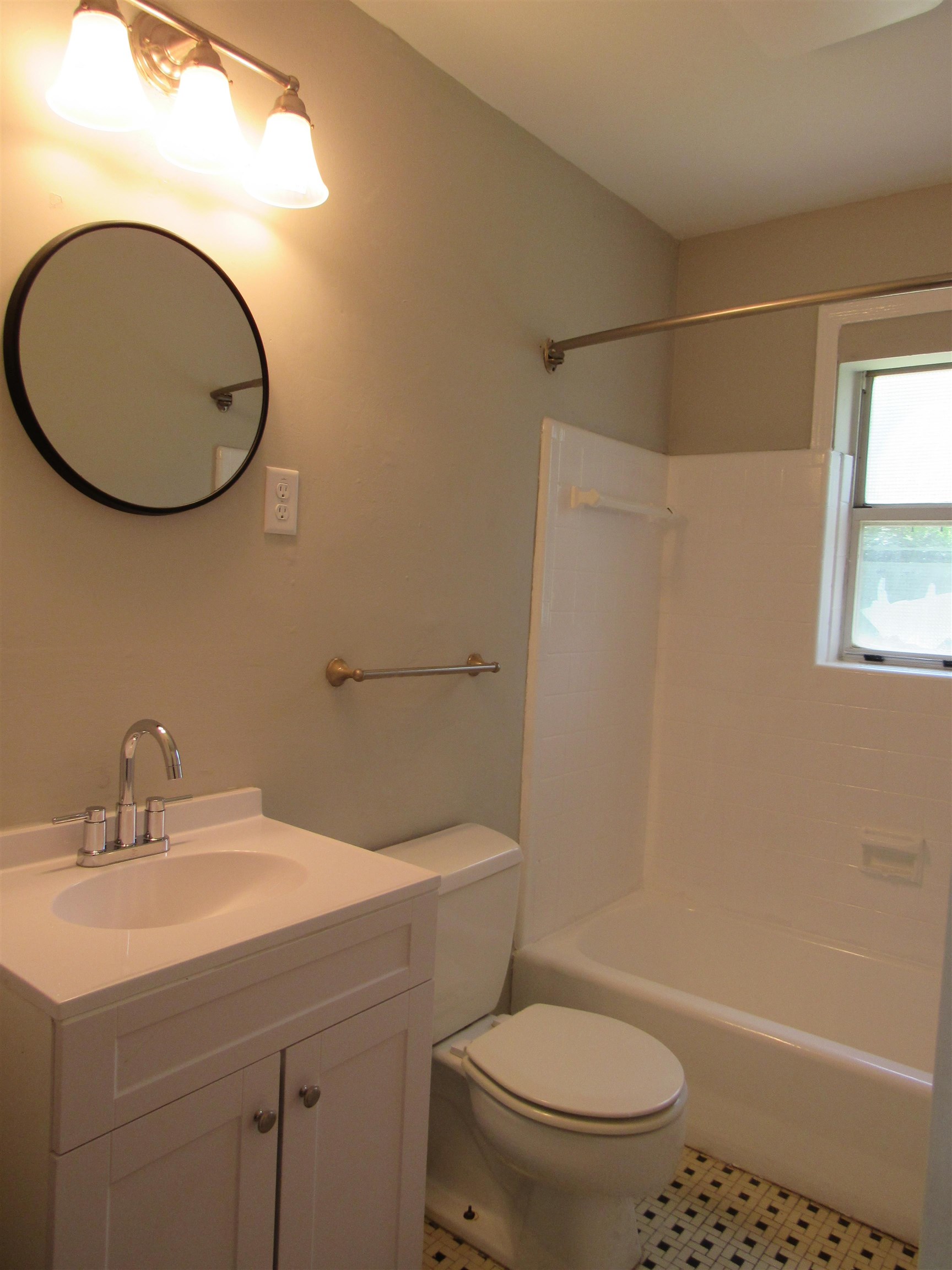 5055 Wingdale Road Memphis, TN 38117 - Photo 7 of 20 Bathroom featuring vanity, light tile patterned floors, and shower combination