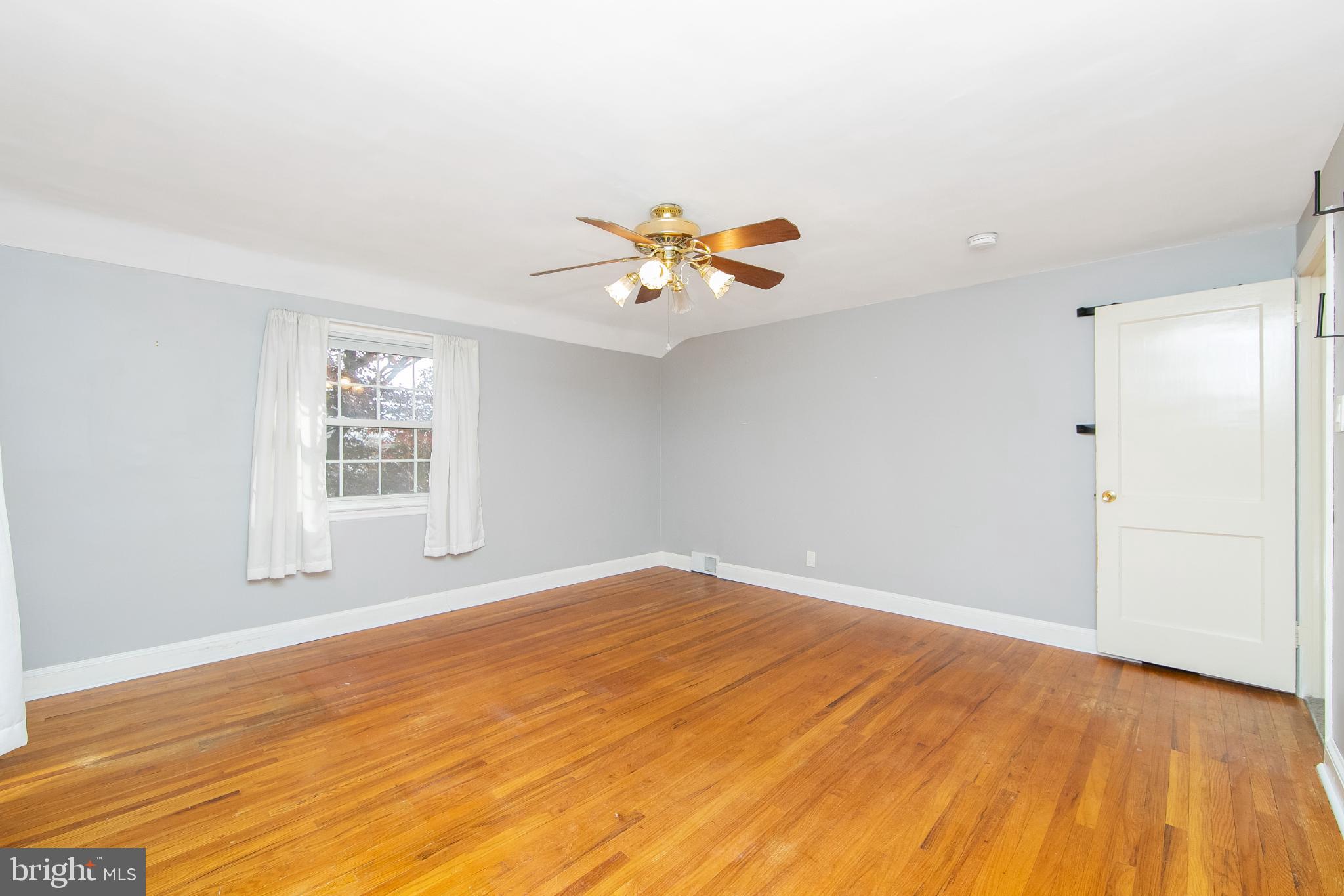 414 Stanfield Road Springfield, PA 19064 - Photo 30 of 51 wooden floor in an empty room with a window
