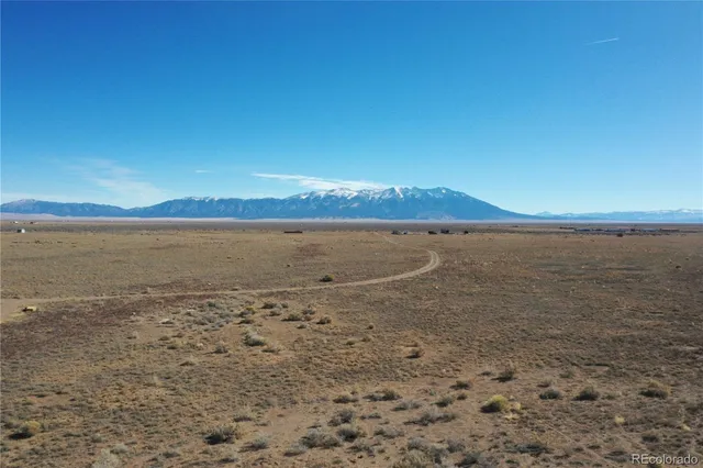 a view of an ocean beach and mountain