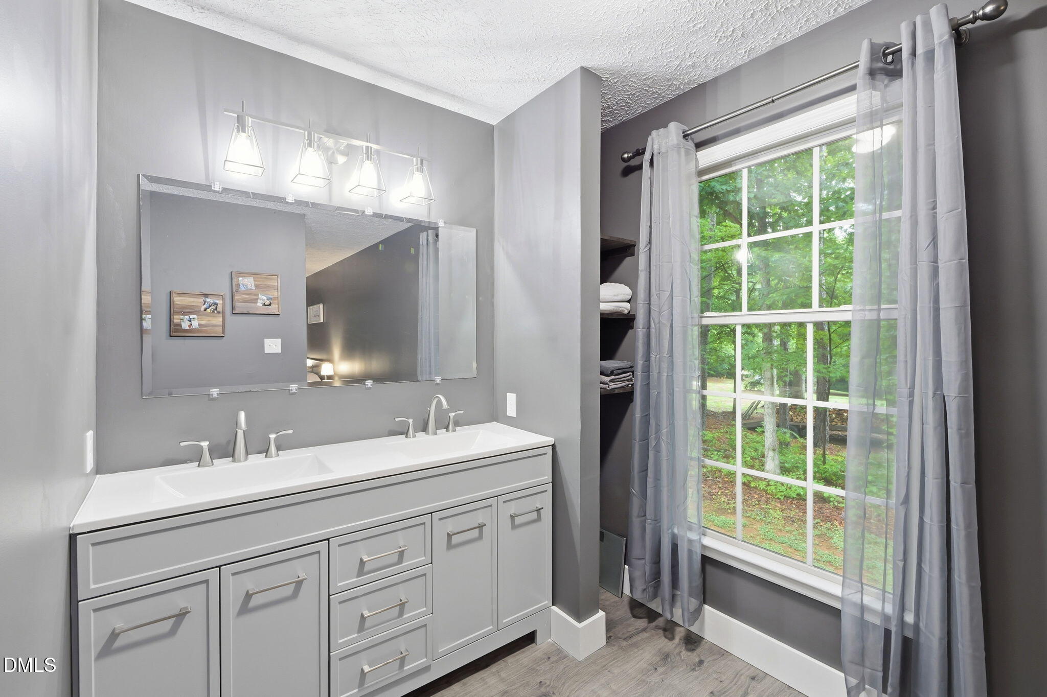 1925 Old Allensville Road Roxboro, NC 27574 - Photo 52 of 58 a bathroom with double vanity and a mirror