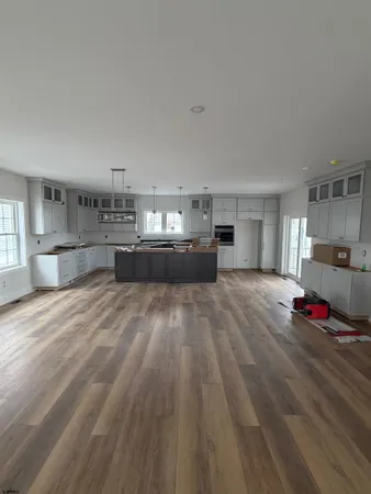 a bed room with a bed and lots of kitchen