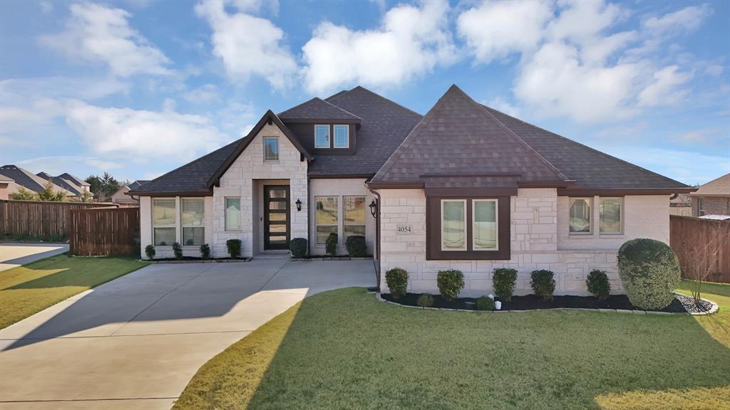 4054 Grove Valley Road Midlothian, TX 76065 - Photo 1 of 25 a front view of a house with garden