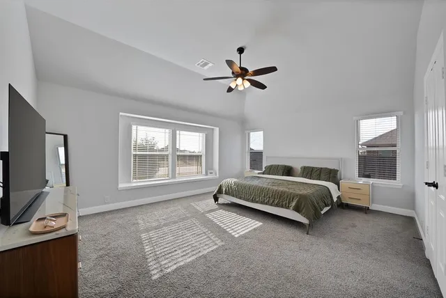 a bedroom with a bed and a couch