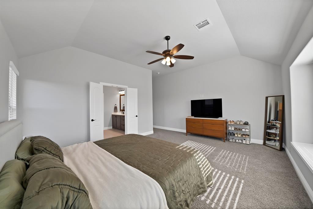 4054 Grove Valley Road Midlothian, TX 76065 - Photo 17 of 25 a bedroom with a bed and a couch