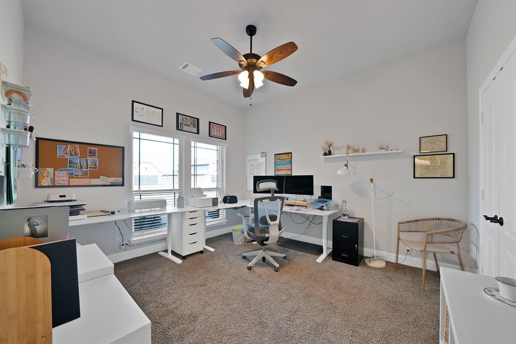 4054 Grove Valley Road Midlothian, TX 76065 - Photo 22 of 25 a work room with furniture a flat screen tv and a window