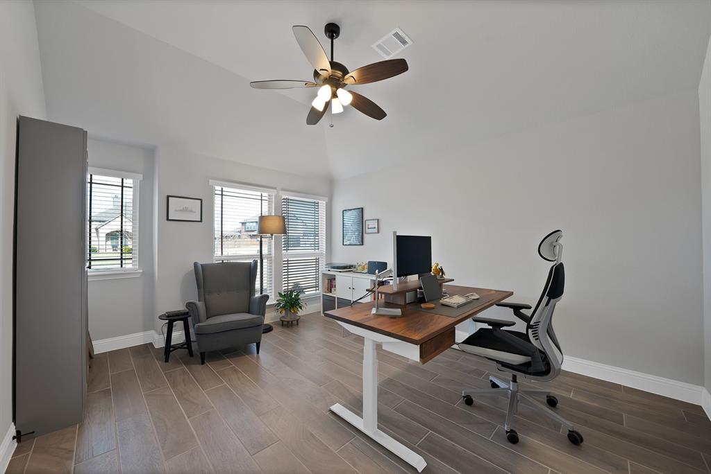 4054 Grove Valley Road Midlothian, TX 76065 - Photo 5 of 25 a work room with furniture and wooden floor