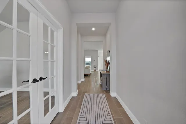 a view of a bathroom from a hallway