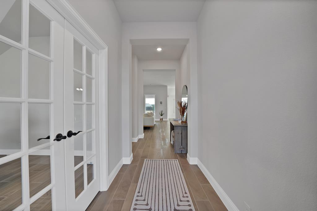 4054 Grove Valley Road Midlothian, TX 76065 - Photo 6 of 25 a view of a bathroom from a hallway