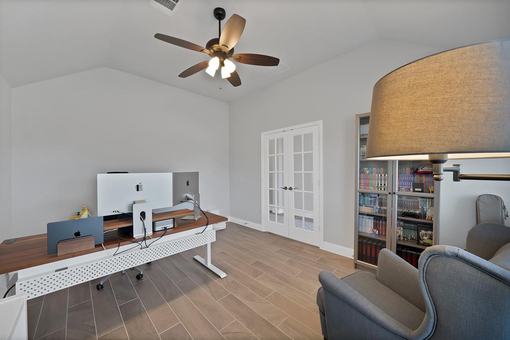 4054 Grove Valley Road Midlothian, TX 76065 - Photo 7 of 25 a living room with furniture and a chandelier