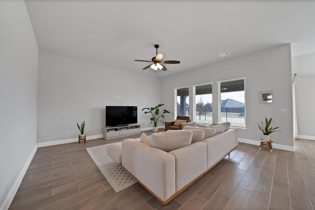 4054 Grove Valley Road Midlothian, TX 76065 - Photo 9 of 25 a living room with furniture and a flat screen tv