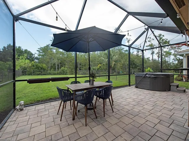 an aerial view of multiple houses with a yard