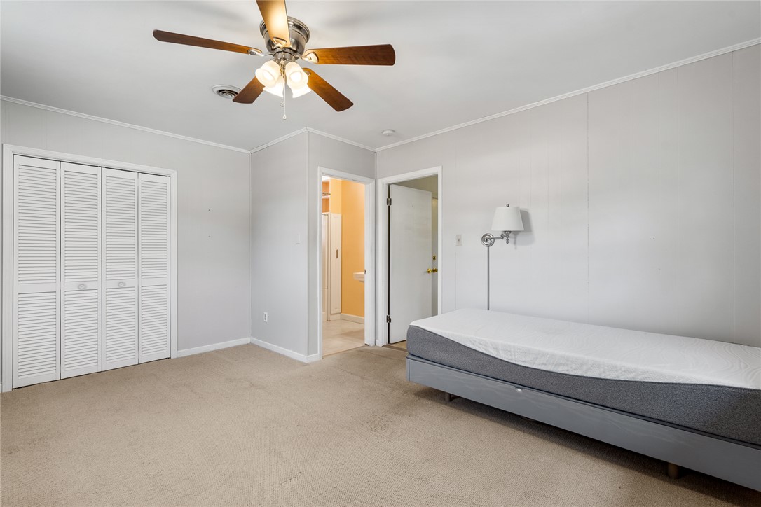 1509 869 Anderson, SC 29621 - Photo 24 of 45 A well-lit bedroom featuring a ceiling fan and convenient closet storage.