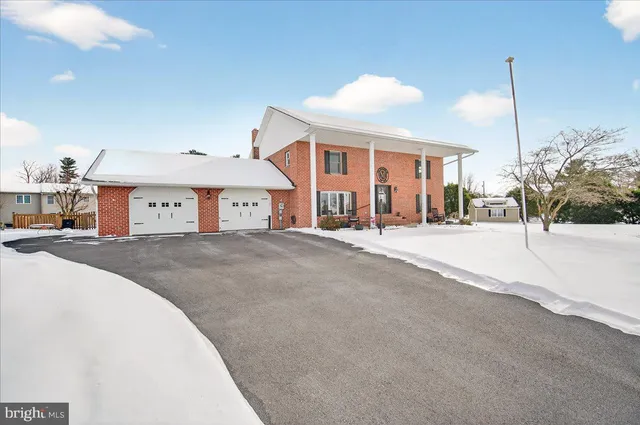 a building outdoor space with patio furniture and entryway