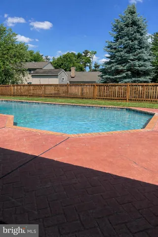 a view of swimming pool with outdoor space and seating area