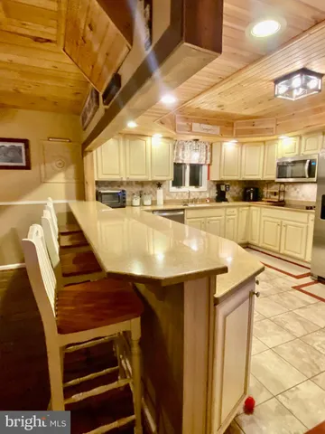 a kitchen with sink and cabinets