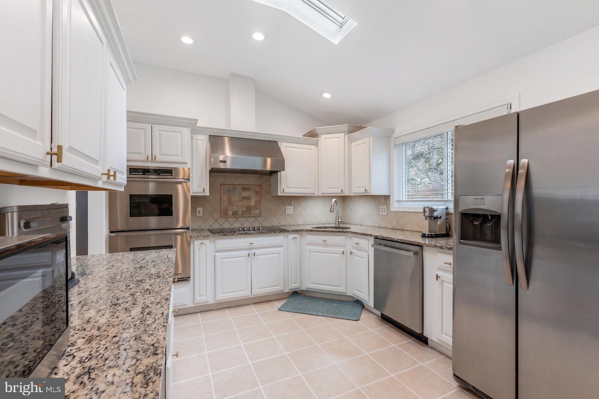 54 Highview Terrace Dover, NJ 07801 - Photo 11 of 35 a kitchen with stainless steel appliances granite countertop a refrigerator sink and cabinets