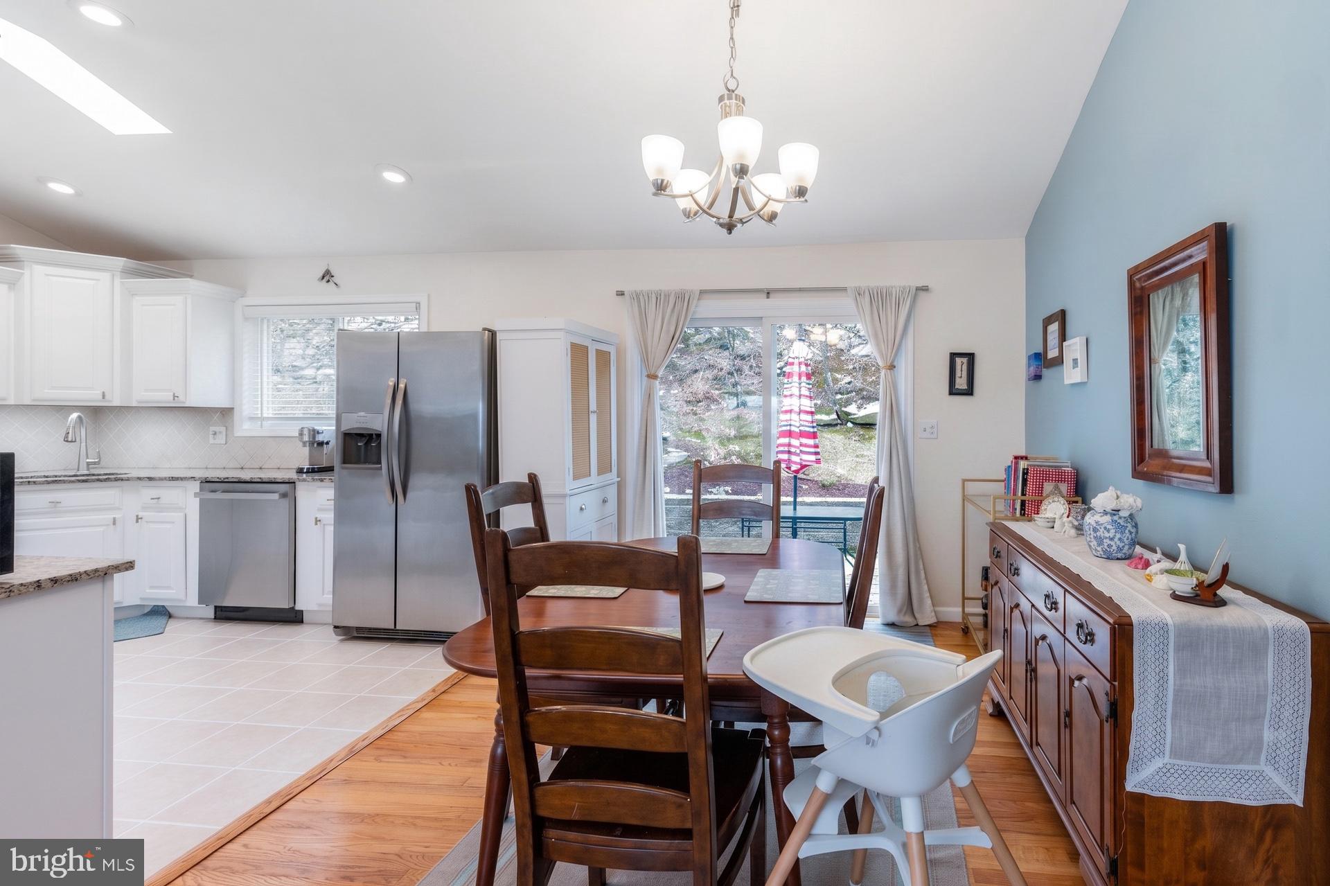 54 Highview Terrace Dover, NJ 07801 - Photo 12 of 35 a view of a dining room with furniture and a chandelier