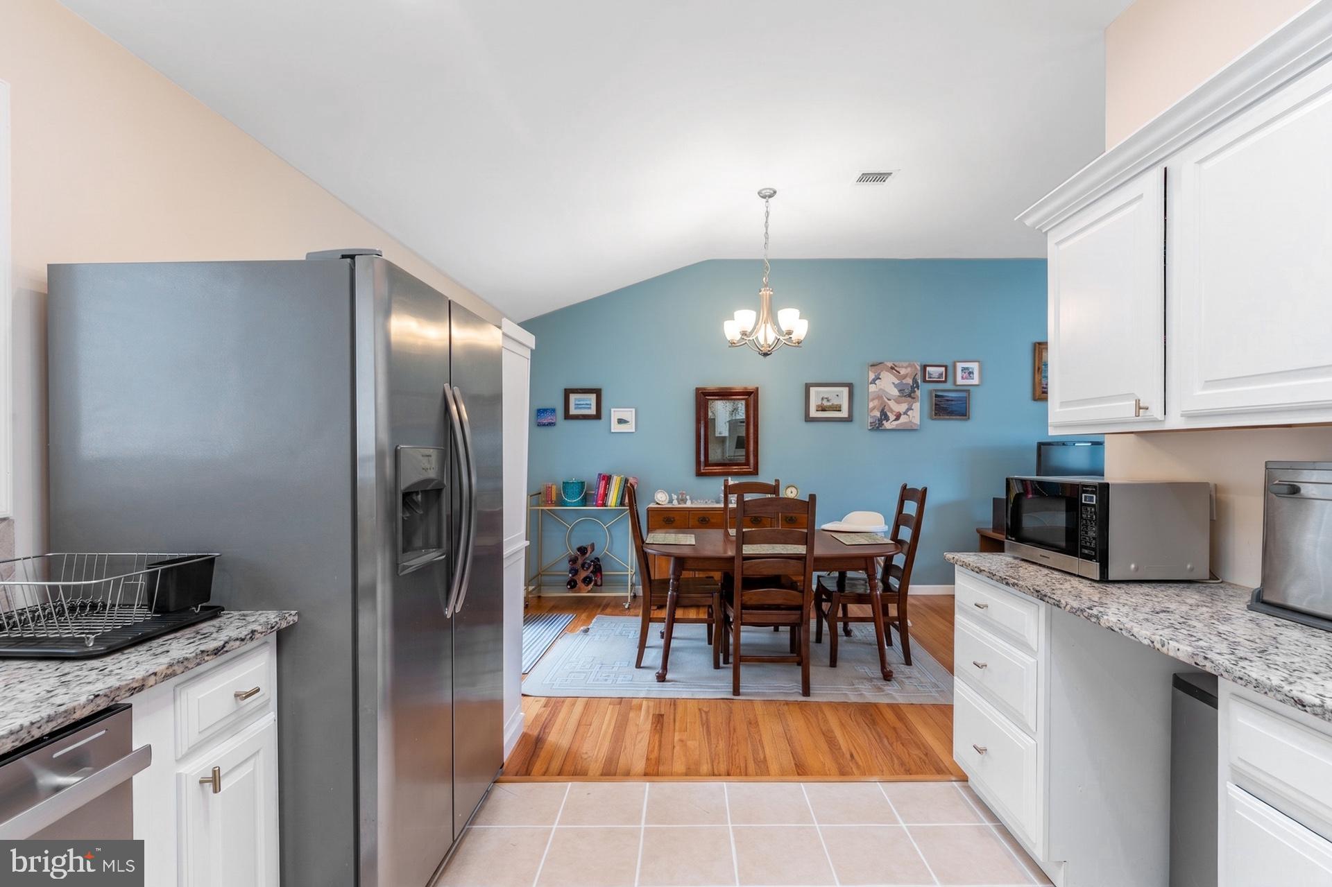 54 Highview Terrace Dover, NJ 07801 - Photo 13 of 35 a kitchen with kitchen island granite countertop a sink cabinets and stainless steel appliances