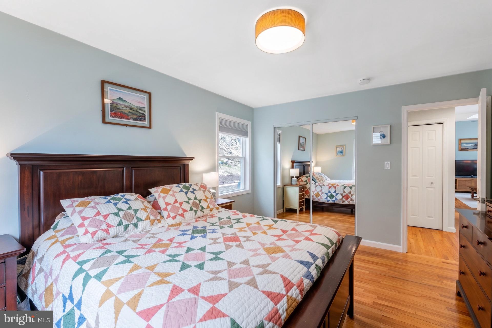 54 Highview Terrace Dover, NJ 07801 - Photo 20 of 35 a bedroom with a large bed and a chandelier