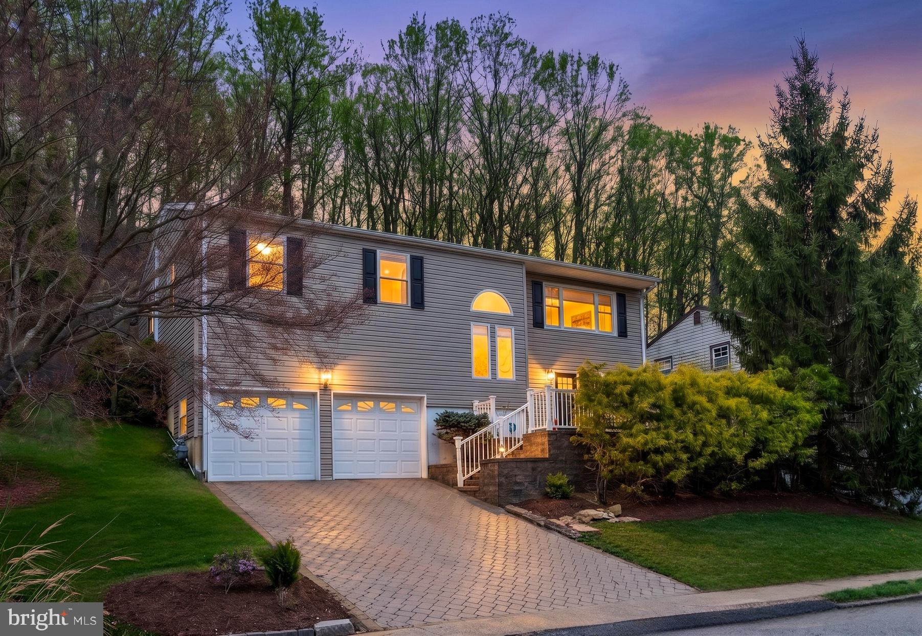 54 Highview Terrace Dover, NJ 07801 - Photo 3 of 35 a front view of a house with a yard and a garage
