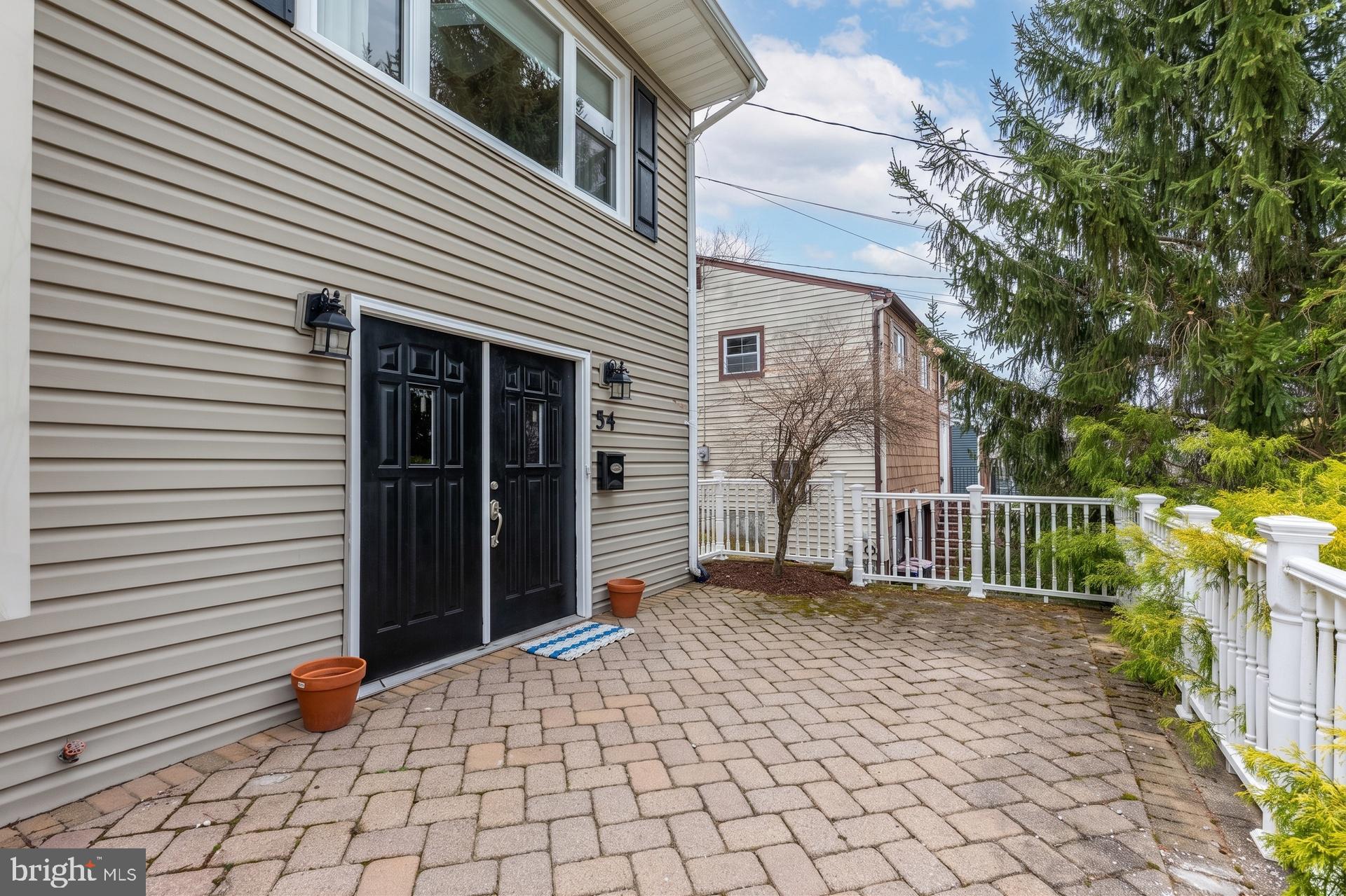 54 Highview Terrace Dover, NJ 07801 - Photo 4 of 35 a porch with a bench next to a yard