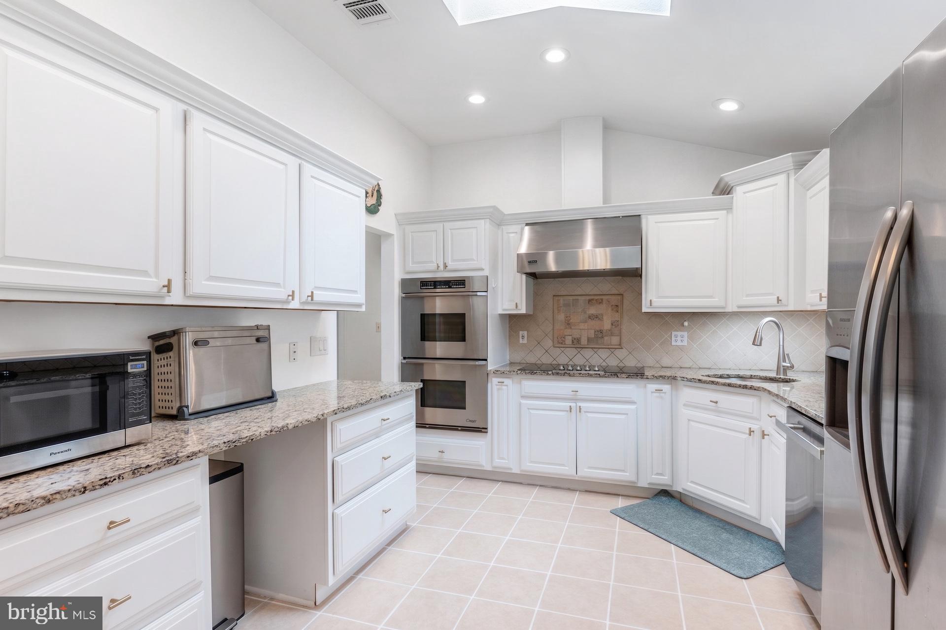 54 Highview Terrace Dover, NJ 07801 - Photo 9 of 35 a kitchen with stainless steel appliances granite countertop a refrigerator sink and cabinets