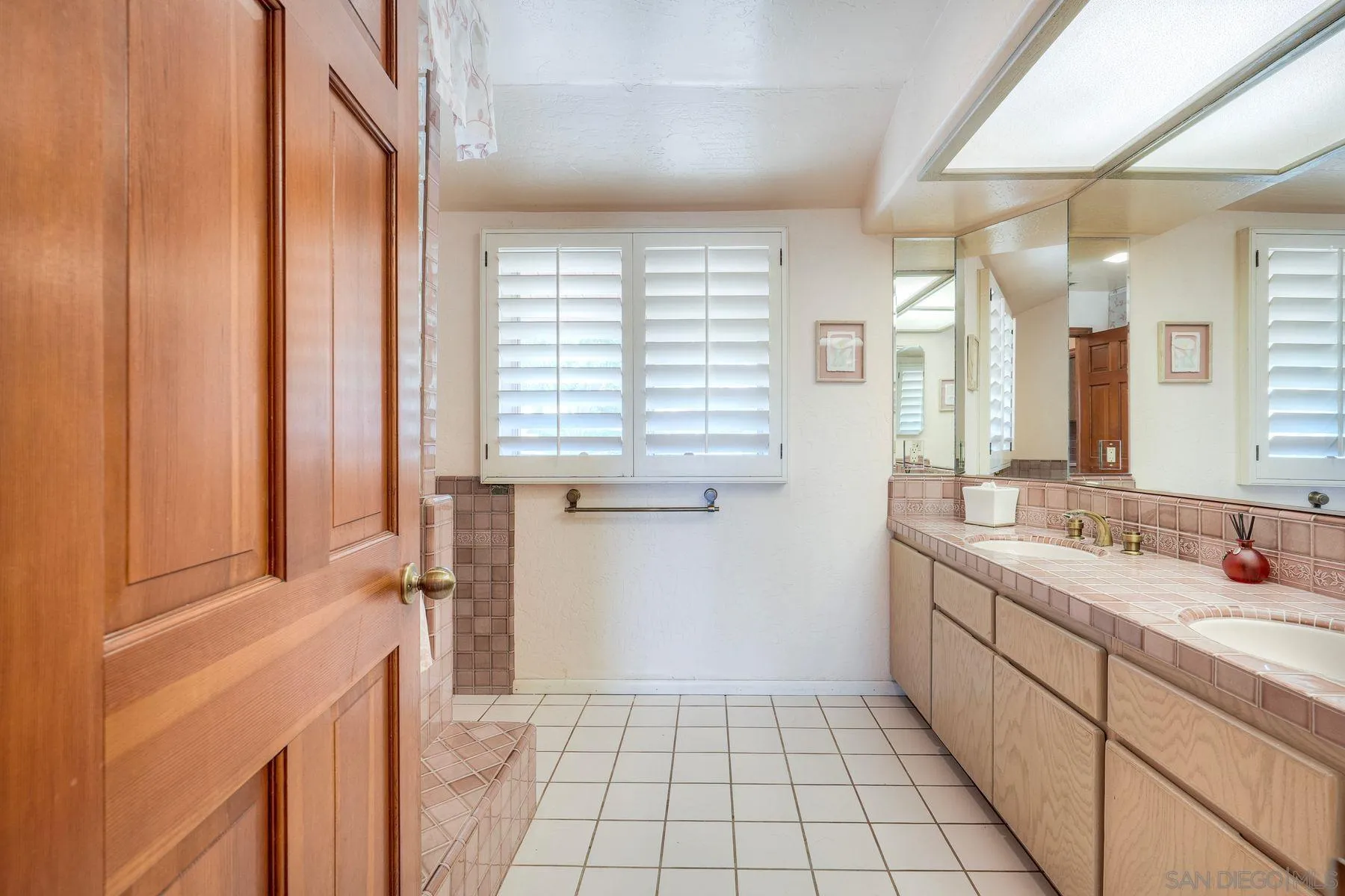 30458 Cool Valley Highlands Road Valley Center, CA 92082 - Photo 31 of 47 a bathroom with a sink a vanity and a mirror