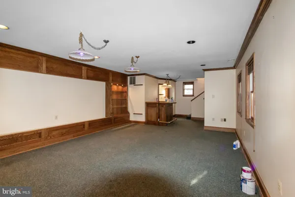 a view of a livingroom with wooden floor and a window