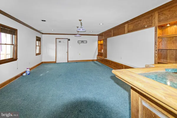 a view of a livingroom with wooden floor and a window