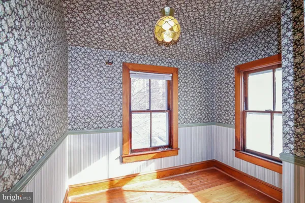 a kitchen with stainless steel appliances granite countertop a refrigerator a stove and a sink