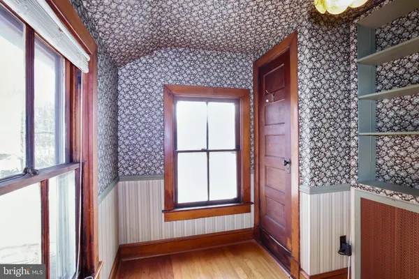 a kitchen with stainless steel appliances granite countertop a refrigerator a stove and a sink