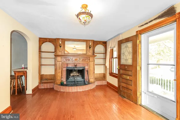 a view of an entryway with wooden floor and stairs
