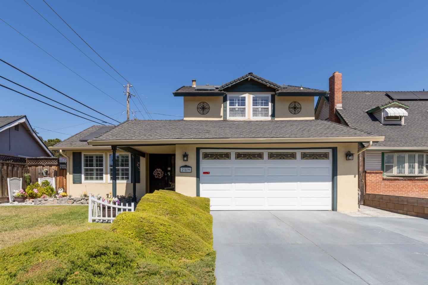 a front view of a house with garden