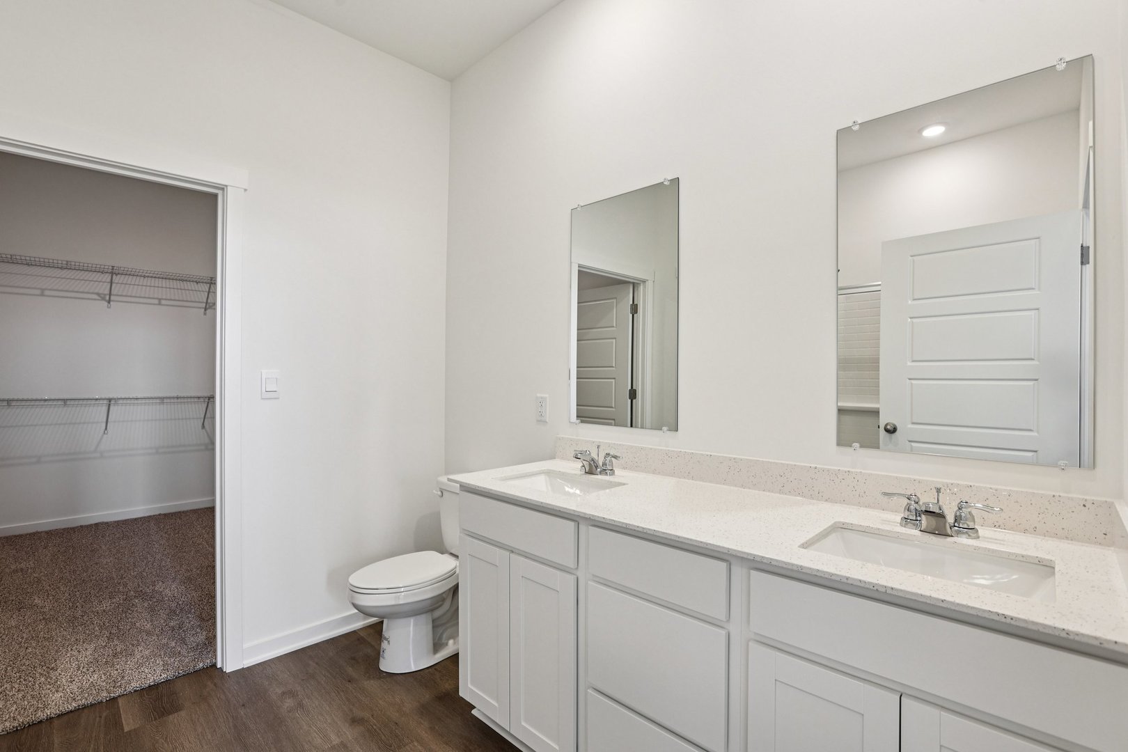 6481 Juniper Drive Wonder Lake, IL 60097 - Photo 18 of 59 a bathroom with a toilet a sink and mirror