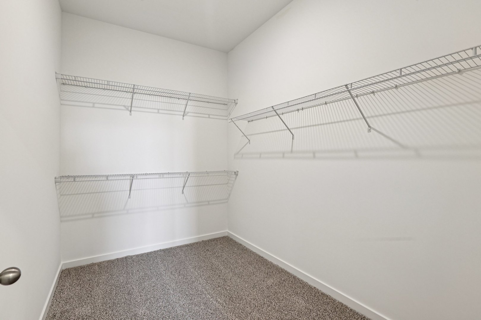 6481 Juniper Drive Wonder Lake, IL 60097 - Photo 19 of 59 a view of a room with racks on the wall