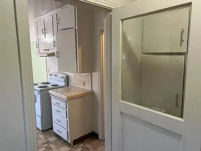 a utility room with a sink washer and dryer