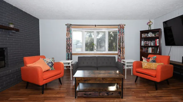 a living room with furniture and a flat screen tv