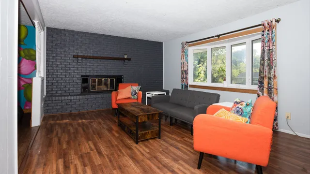 a living room with furniture and a fireplace