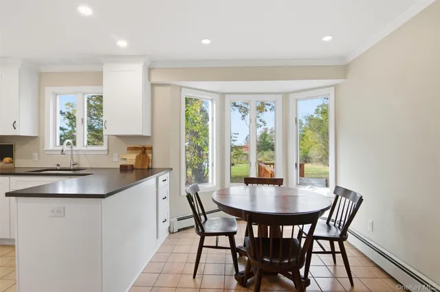 a dining room with furniture and window