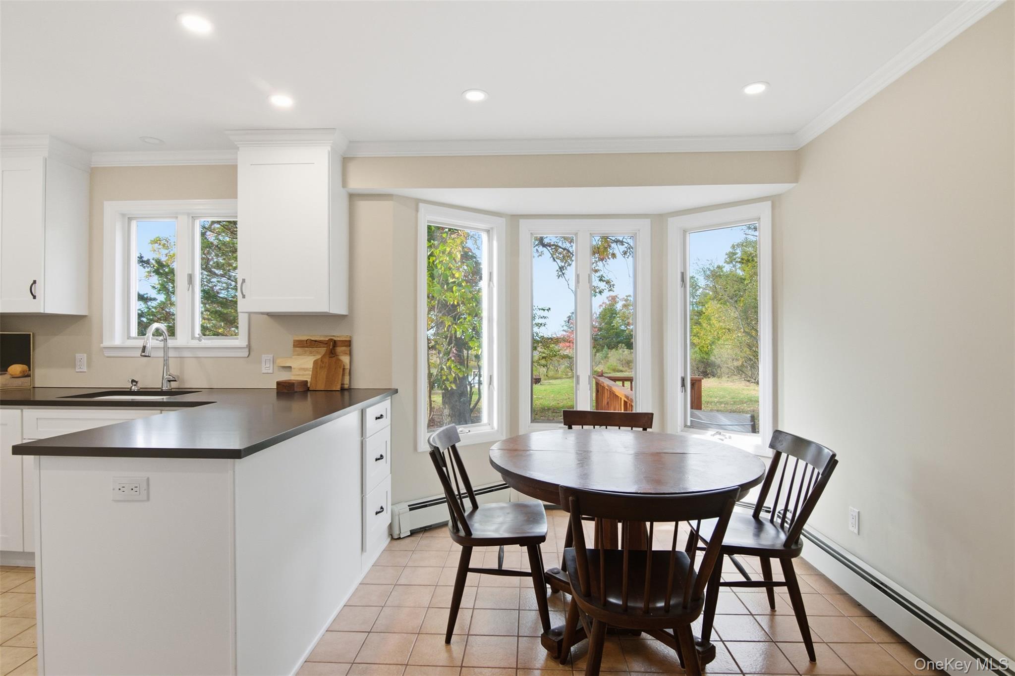 14 Flax Pond Woods Road Setauket, NY 11733 - Photo 14 of 41 a dining room with furniture and window