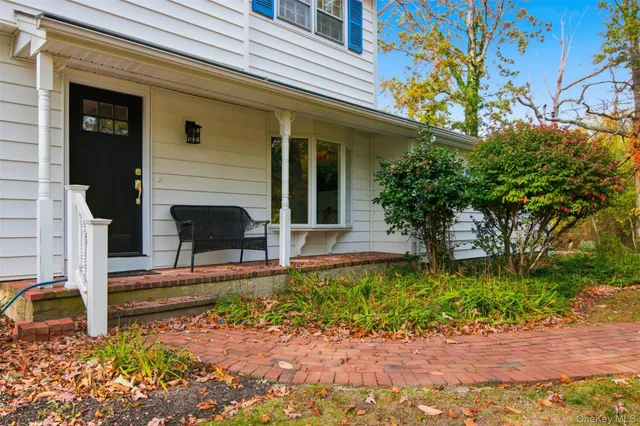 a view of a house with a small yard
