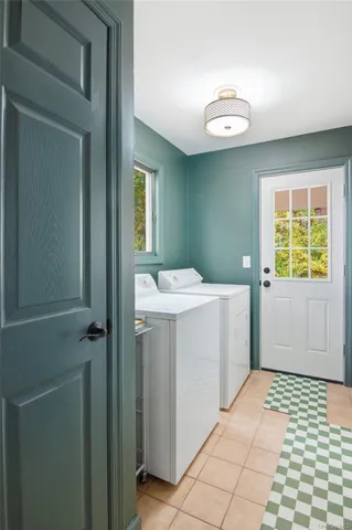 a bathroom with a sink a toilet and a window