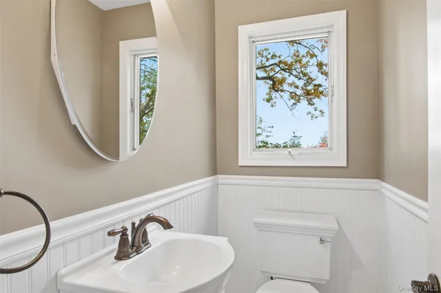 a bathroom with a toilet and a sink