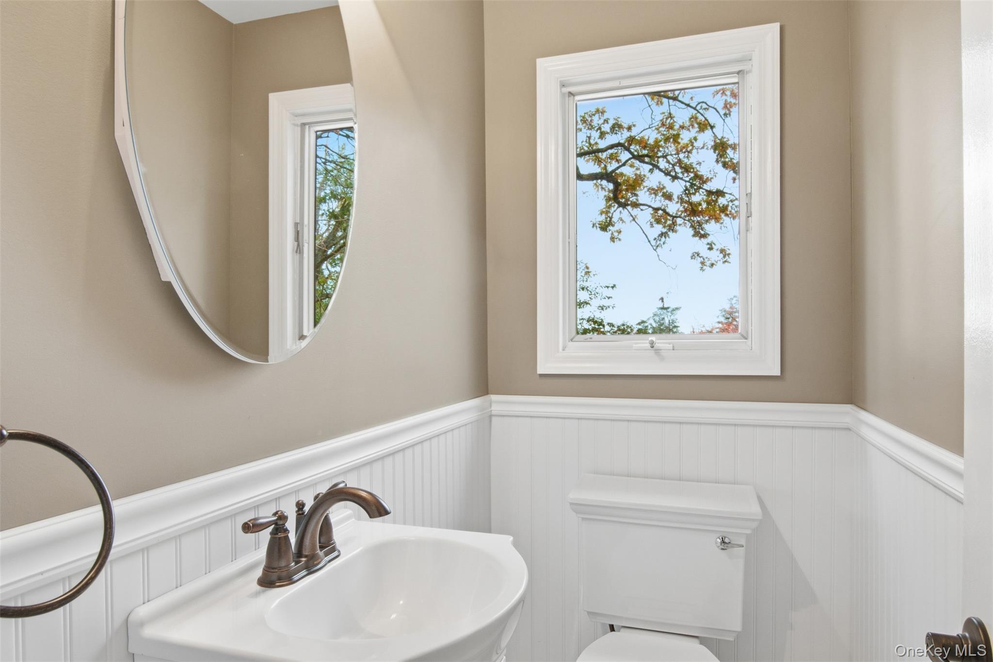 14 Flax Pond Woods Road Setauket, NY 11733 - Photo 26 of 41 a bathroom with a toilet and a sink