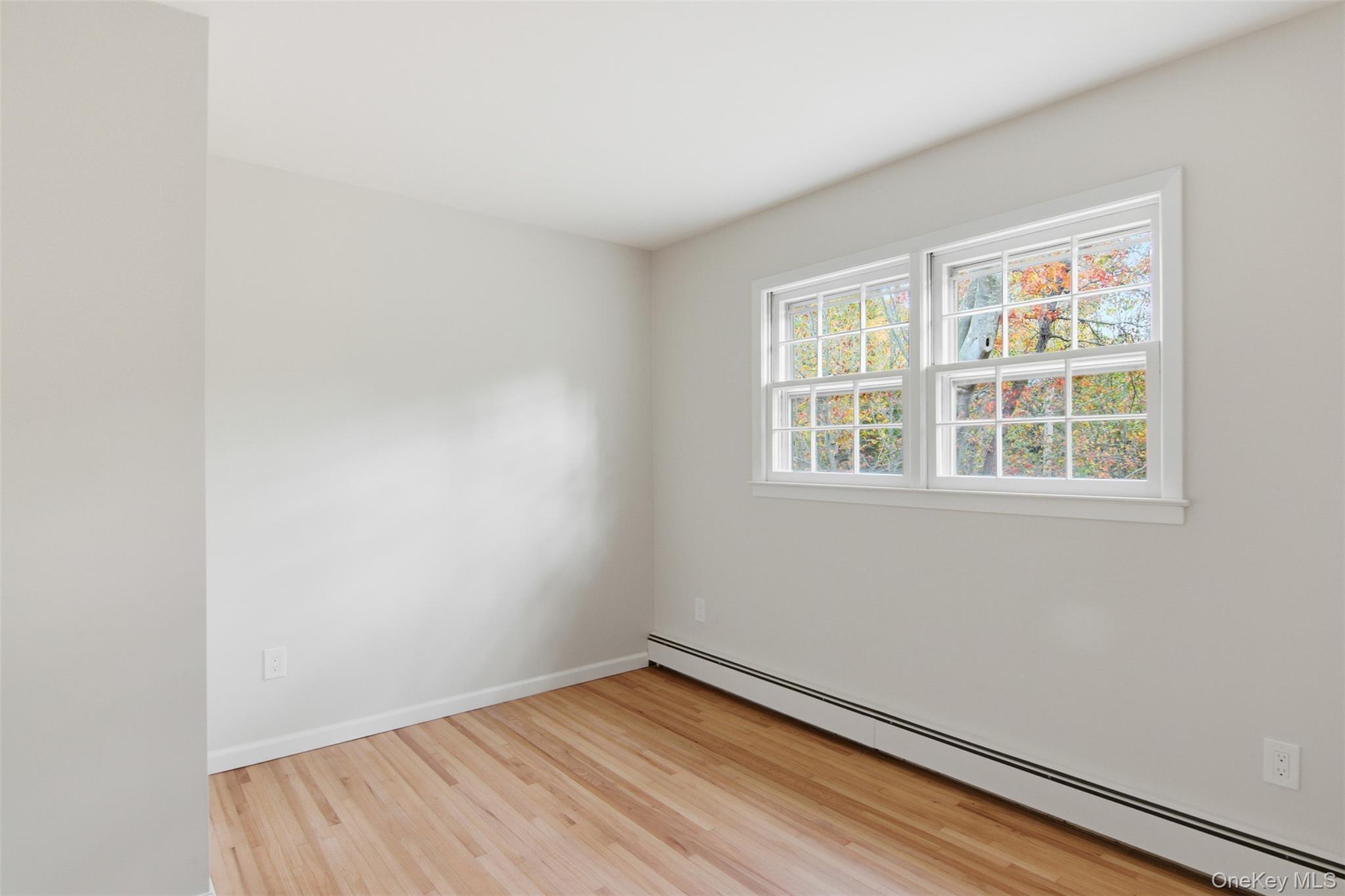 14 Flax Pond Woods Road Setauket, NY 11733 - Photo 30 of 41 an empty room with a window