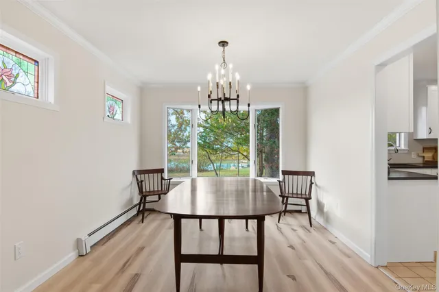 a view of a dining room with furniture window and outside view