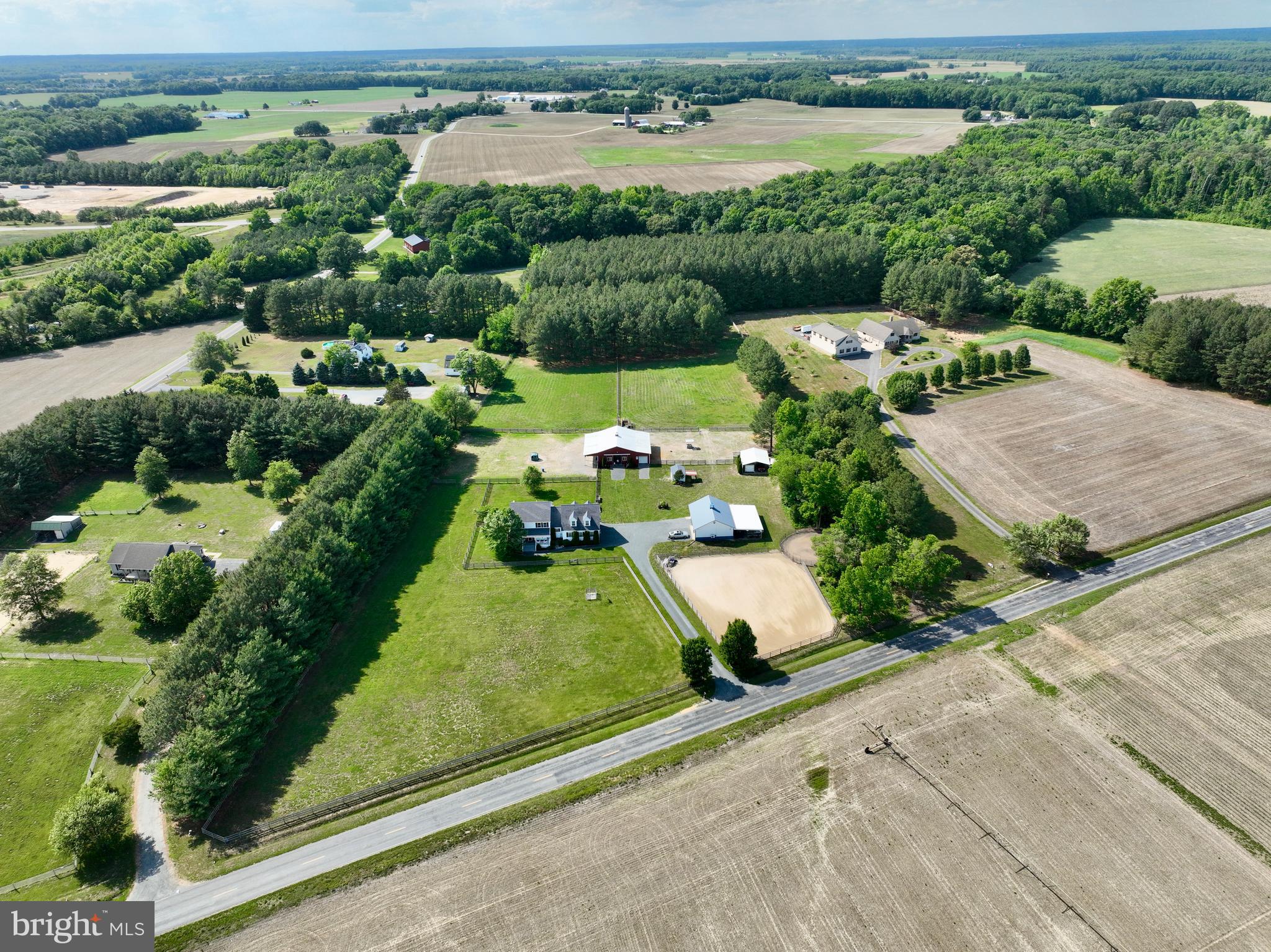 12136 Holly Road Ridgely, MD 21660 - Photo 124 of 136 an aerial view of a house with a garden and lake view