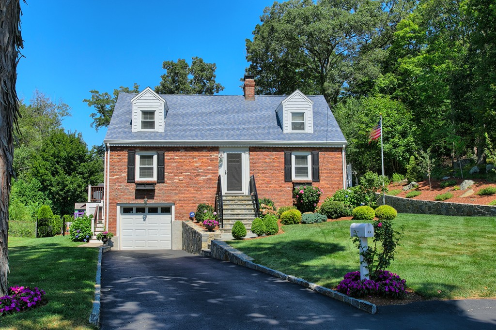 29 Spring Street Wakefield, MA 01880 - Photo 1 of 30 a front view of a house with a yard and outdoor seating