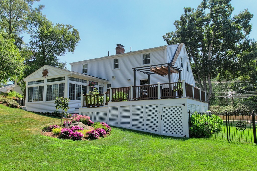 29 Spring Street Wakefield, MA 01880 - Photo 20 of 30 a front view of house with yard and trees